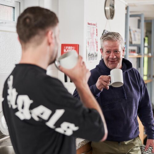 Two men having a cup of tea