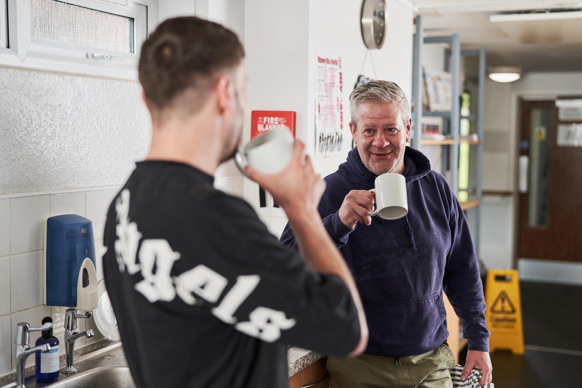 Two men having a cup of tea