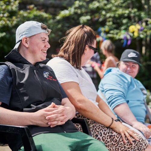 Group of people sitting in the sun