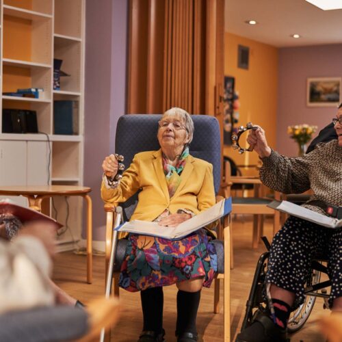 Older age women playing with musical instruments