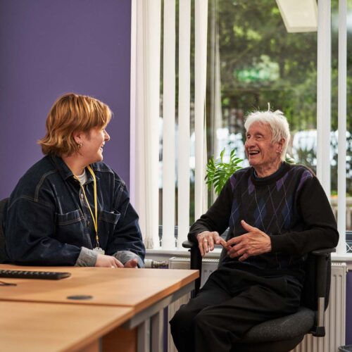 Carer having conversation with man