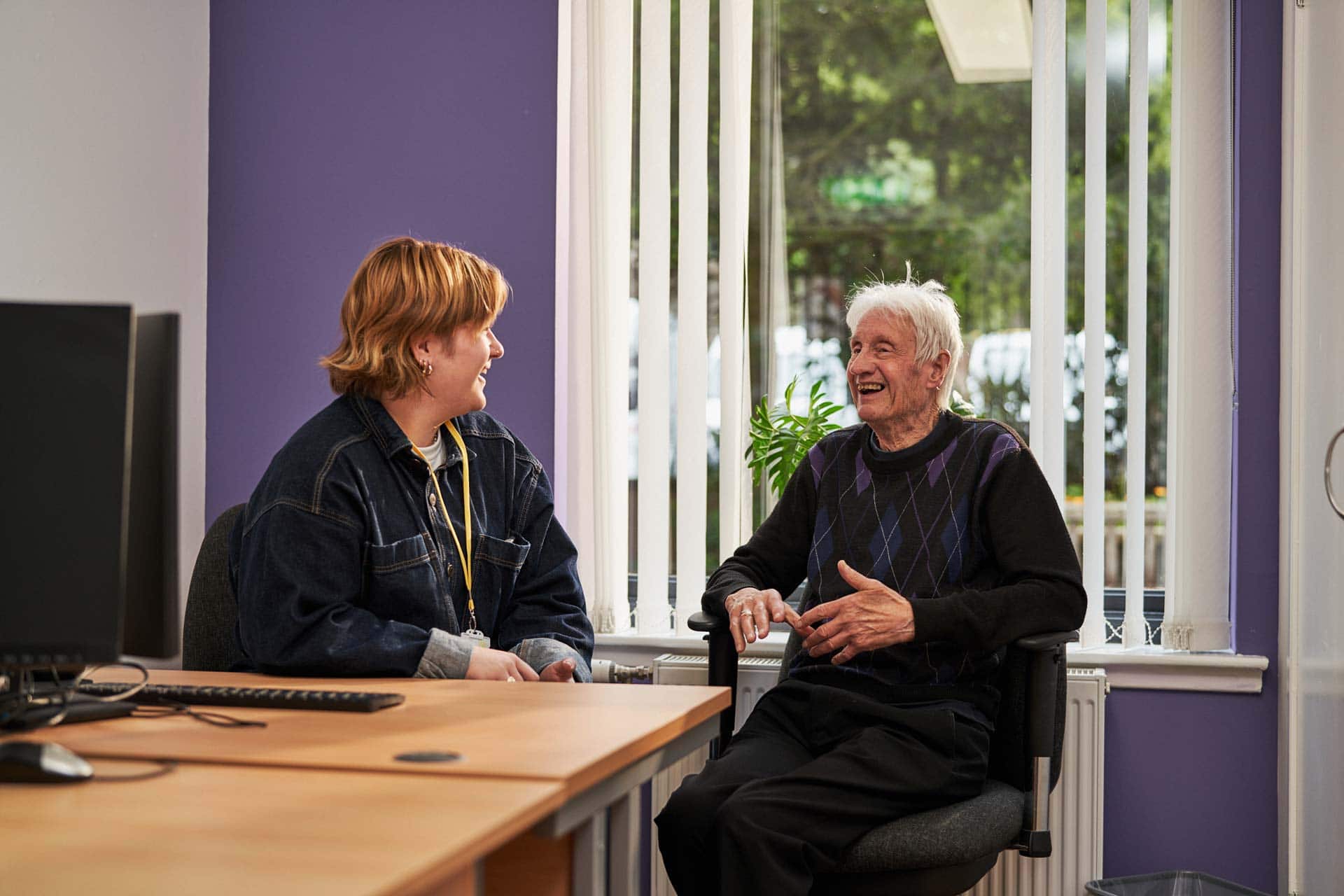 Carer having conversation with man