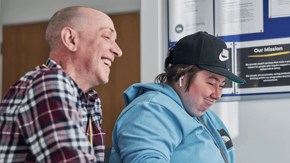 Care Support Scotland - Support worker helps resident get online