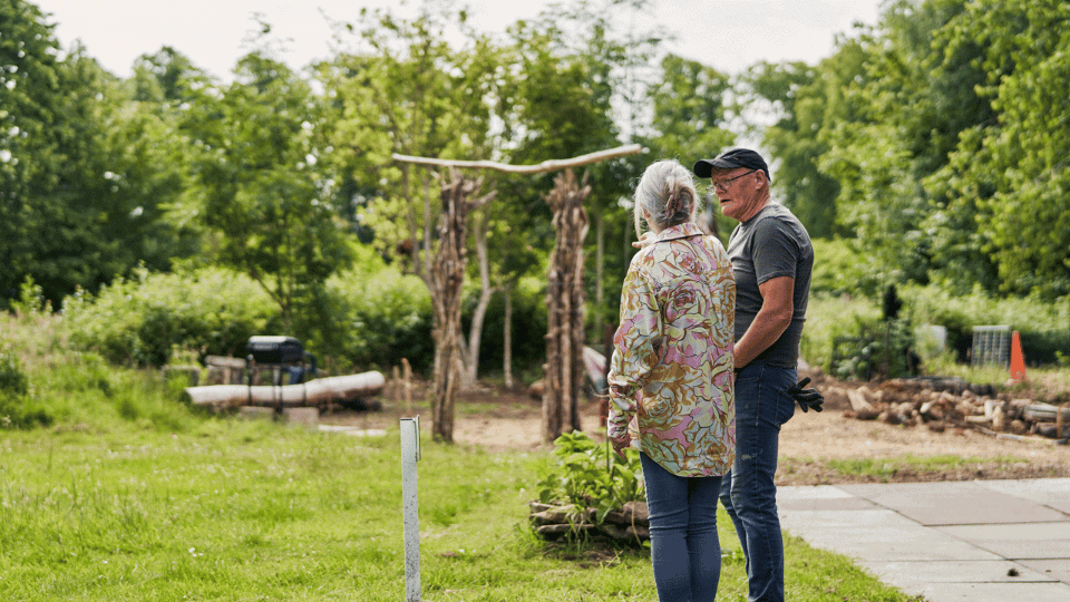 Care Support Scotland - Access to outdoor gardening area - two people survey the garden scene